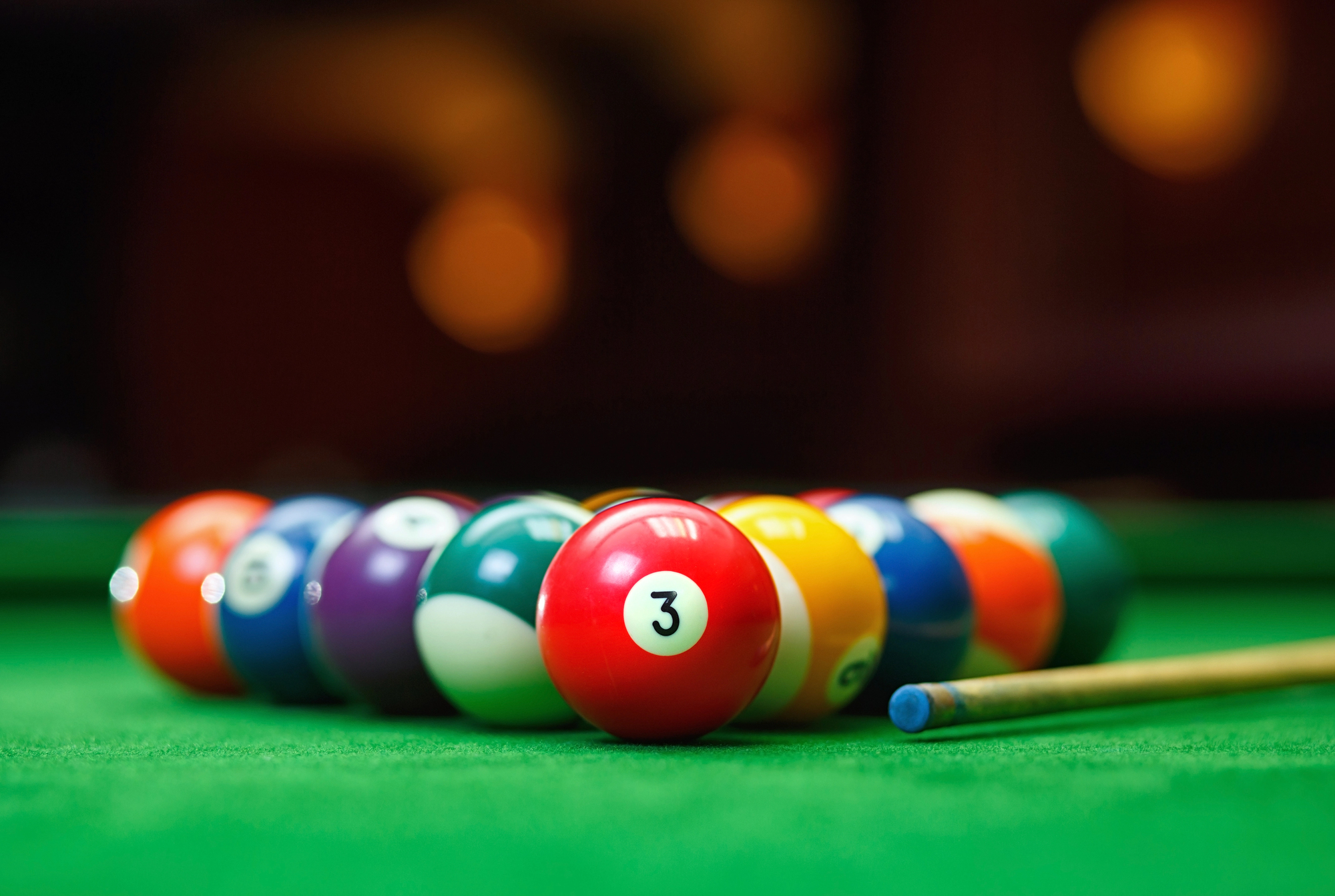 Billiard balls in a green pool table 